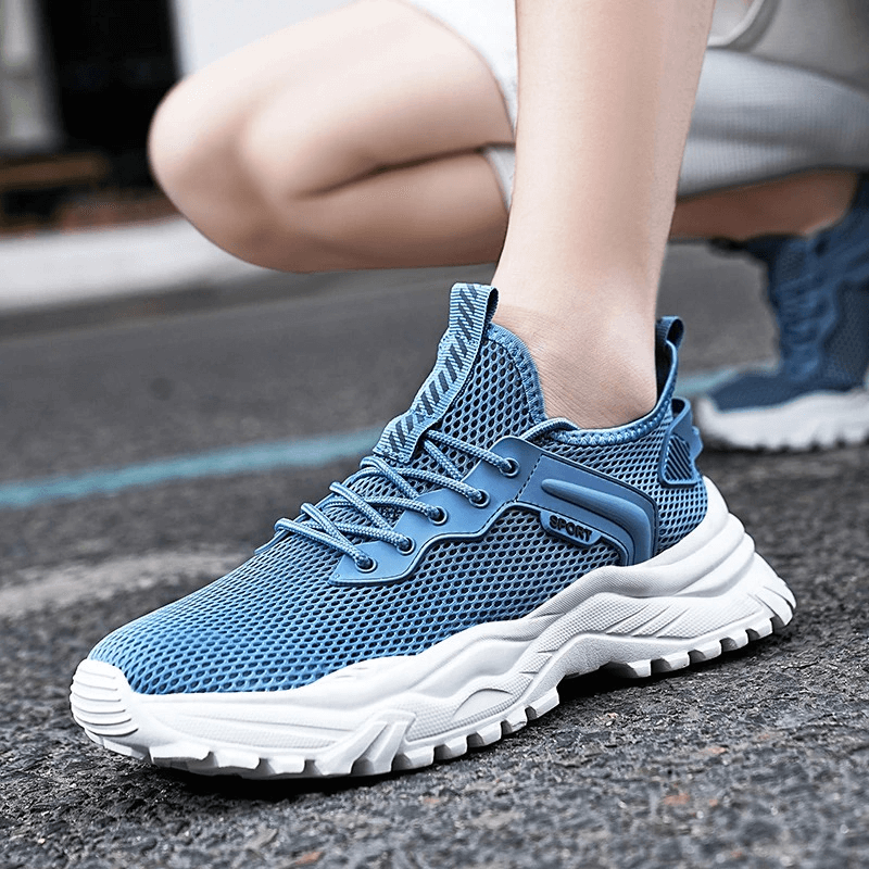 Blue breathable running shoes with cushioning, ideal for male athletes, featuring air mesh upper and lace-up closure.